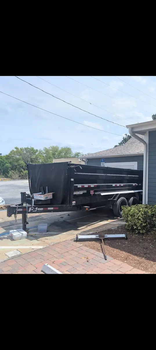 The Orchid Cleaning Service dump trailer used for junk removal and property cleanouts