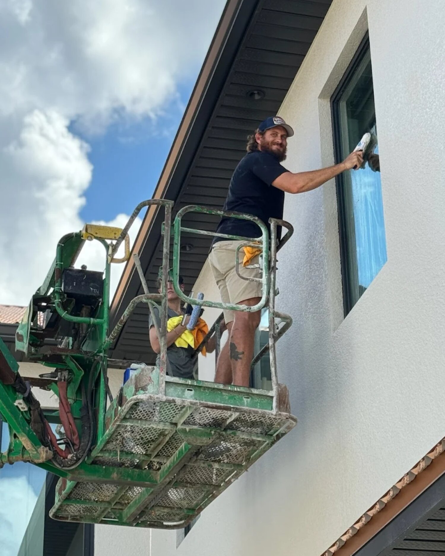 Orchid Cleaning crew on a lift cleaning the exterior windows of a commercial building
